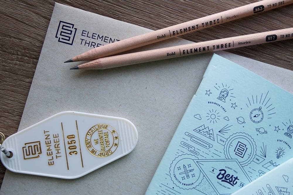 Element Three branded pencils with 'Stories' text and packaging with design sketches