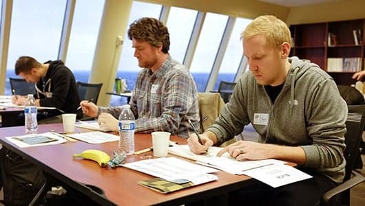 Team members reviewing documents at conference table