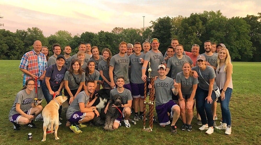 Element Three team wearing matching shirts at outdoor company kickball event