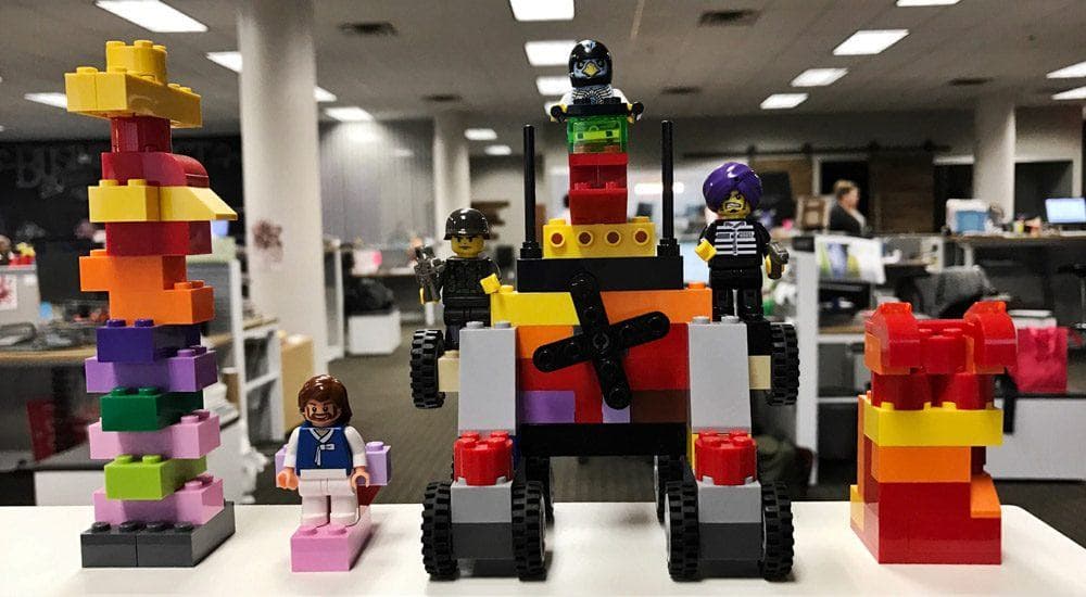 LEGO construction set with colorful blocks and minifigure characters