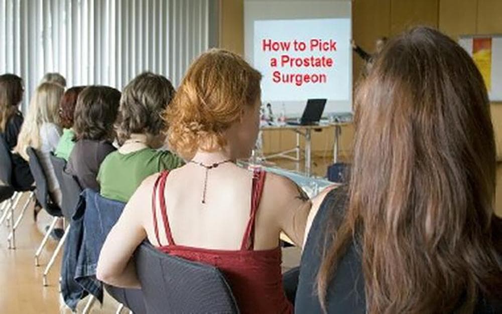 Movie scene of audience in presentation looking at screen with text