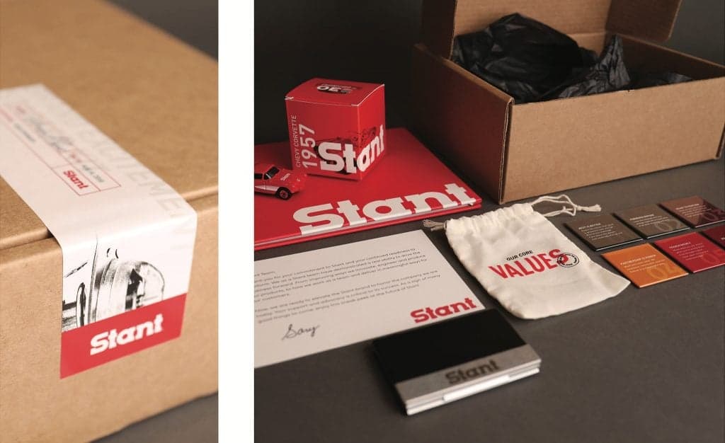 Stant rebrand merchandise unboxing with branded materials and apparel