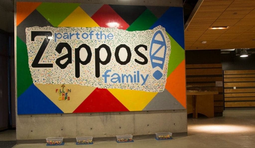 Zappos office wall display with company logo
