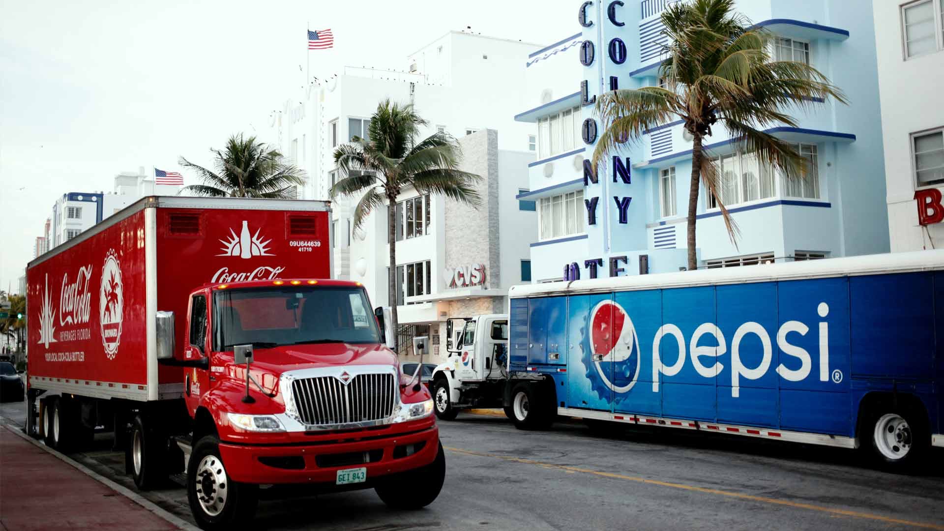 Coca Cola and Pepsi Trucks on Street