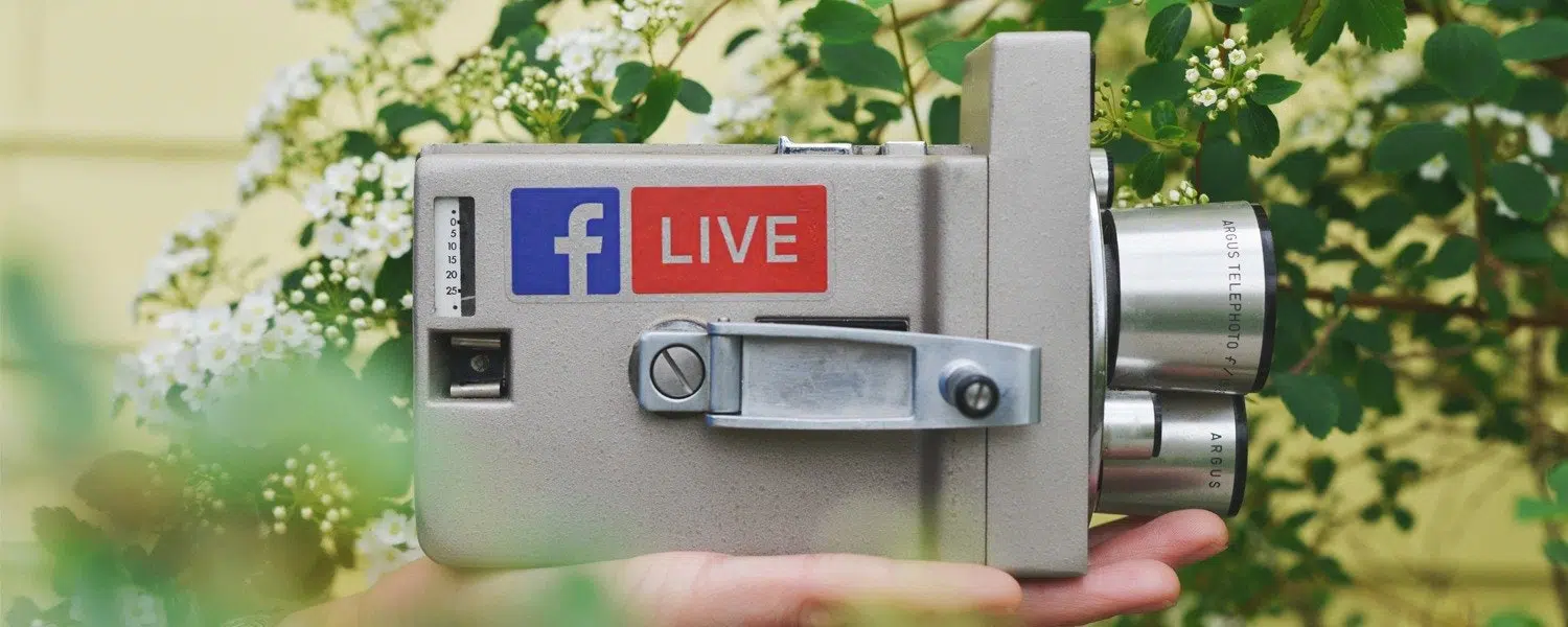 Old fashioned camera with "Facebook Live" on the side of it