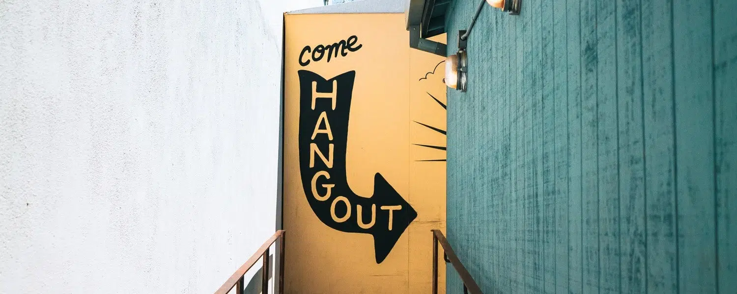 wall mural at building entrance inviting people to come hang out