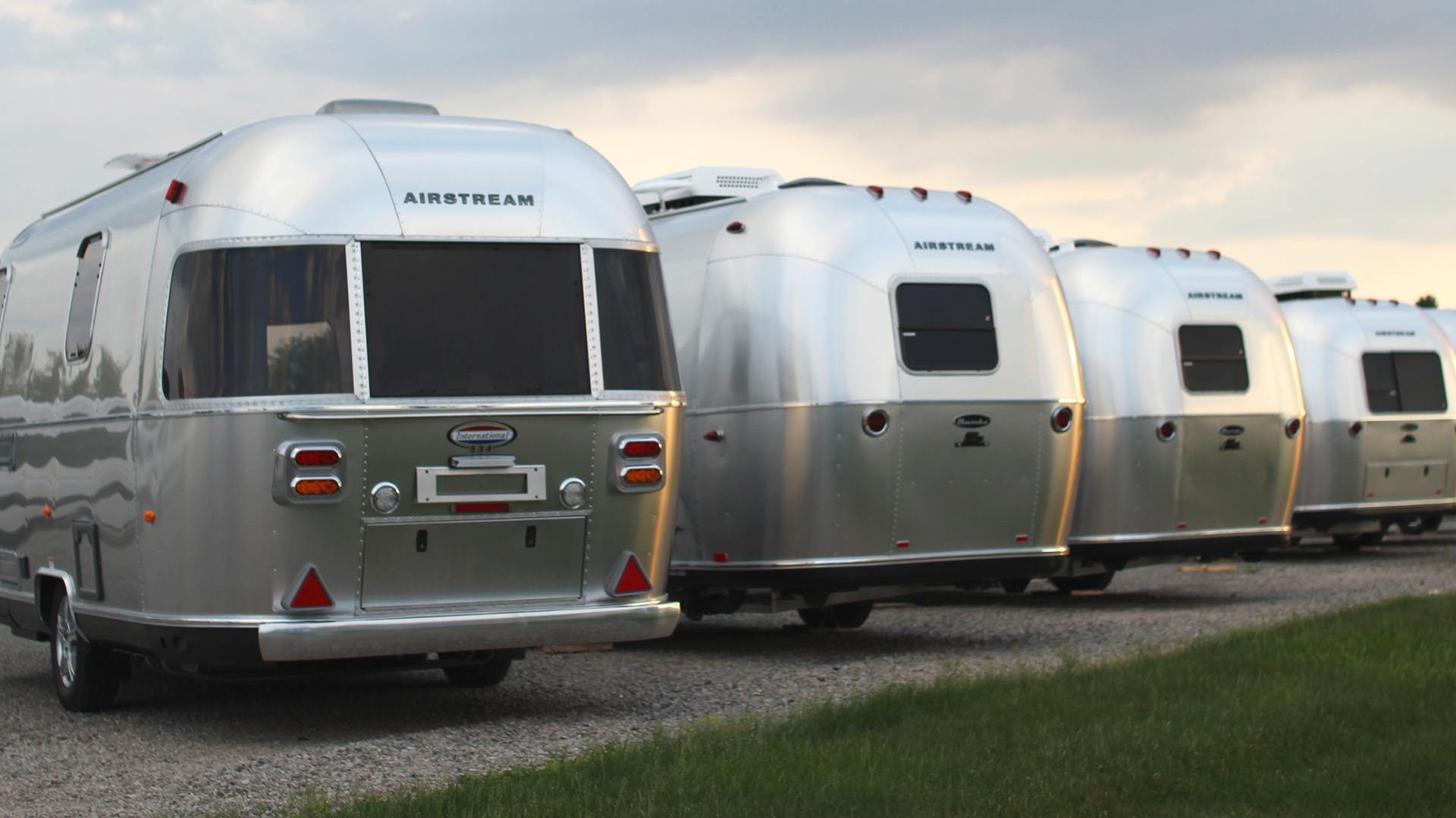 row of airstream trailers parked