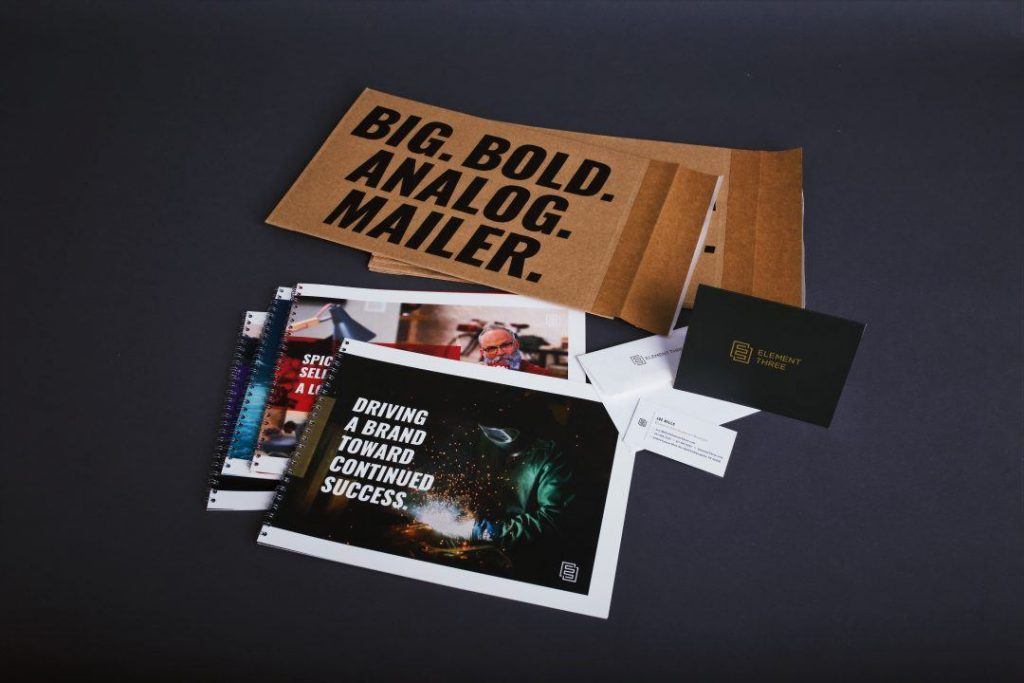 E3 Direct Mail Campaign Showcasing Case Studies and Branded Envelopes