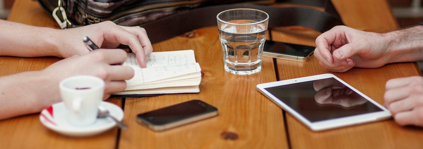 marketers discussing concepts over coffee