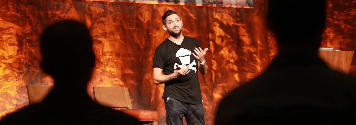 t-shirt entrepreneur speaking on stage