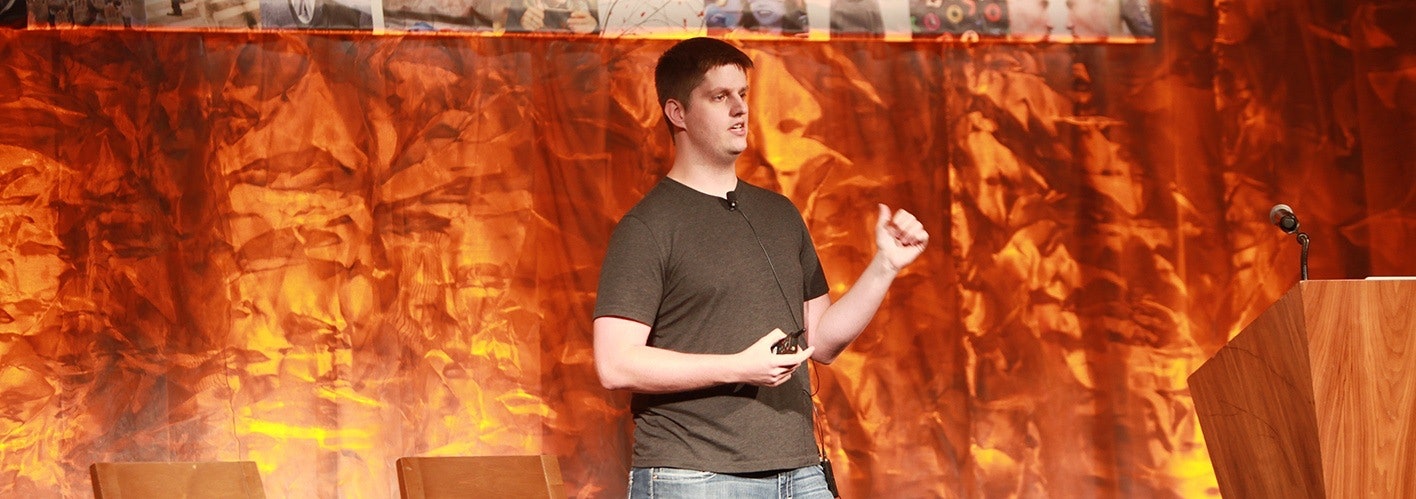 Lars Lofgrens speaking on stage