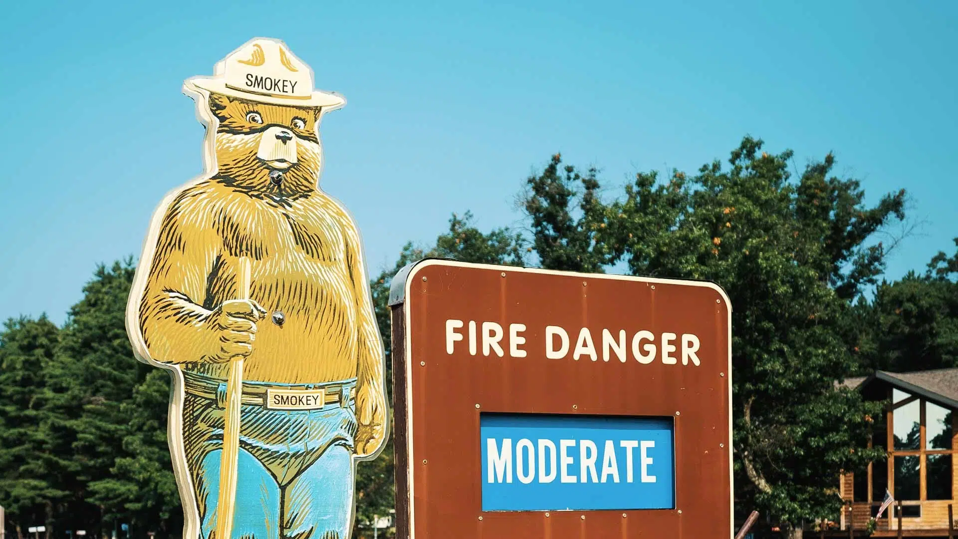 Smokey Bear Road Sign Next to Fire Danger