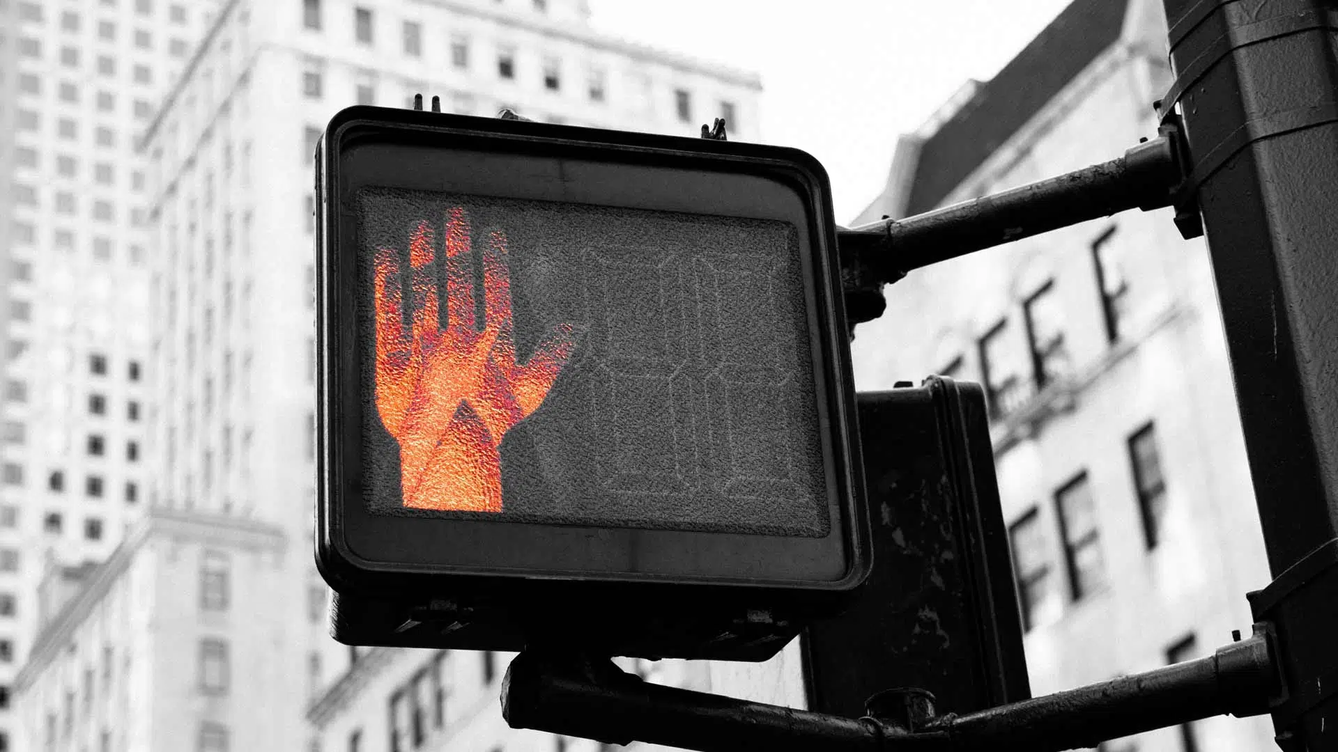 Orange Hand Flashing Do Not Go on Street Sign