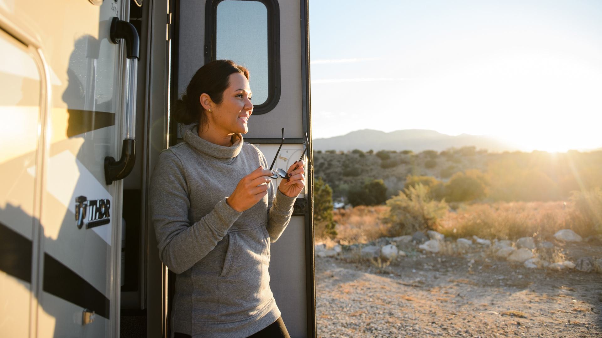 Millennial Woman Opening RV Door