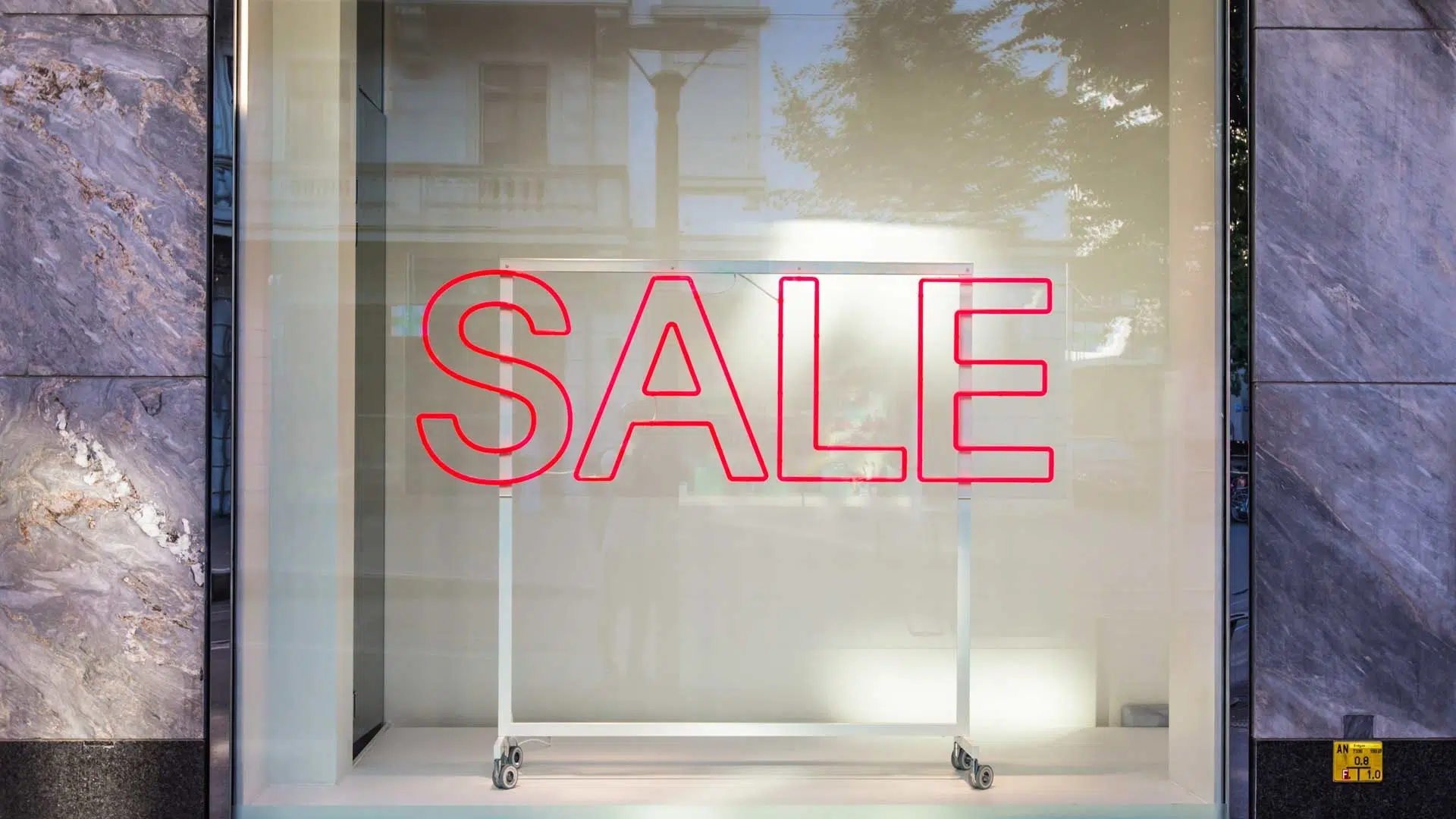 Red Sale Sign in Retail Window