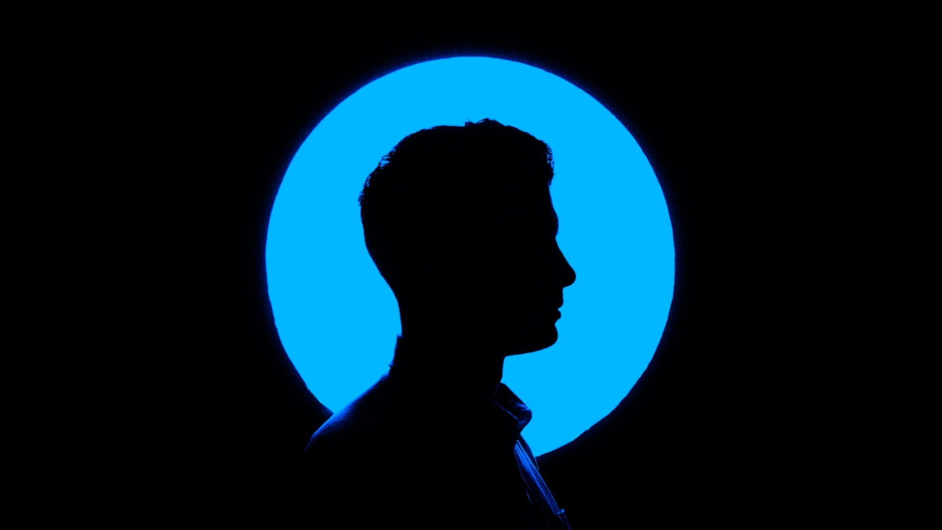 Human Identity Silhouette in Front of Blue Circle
