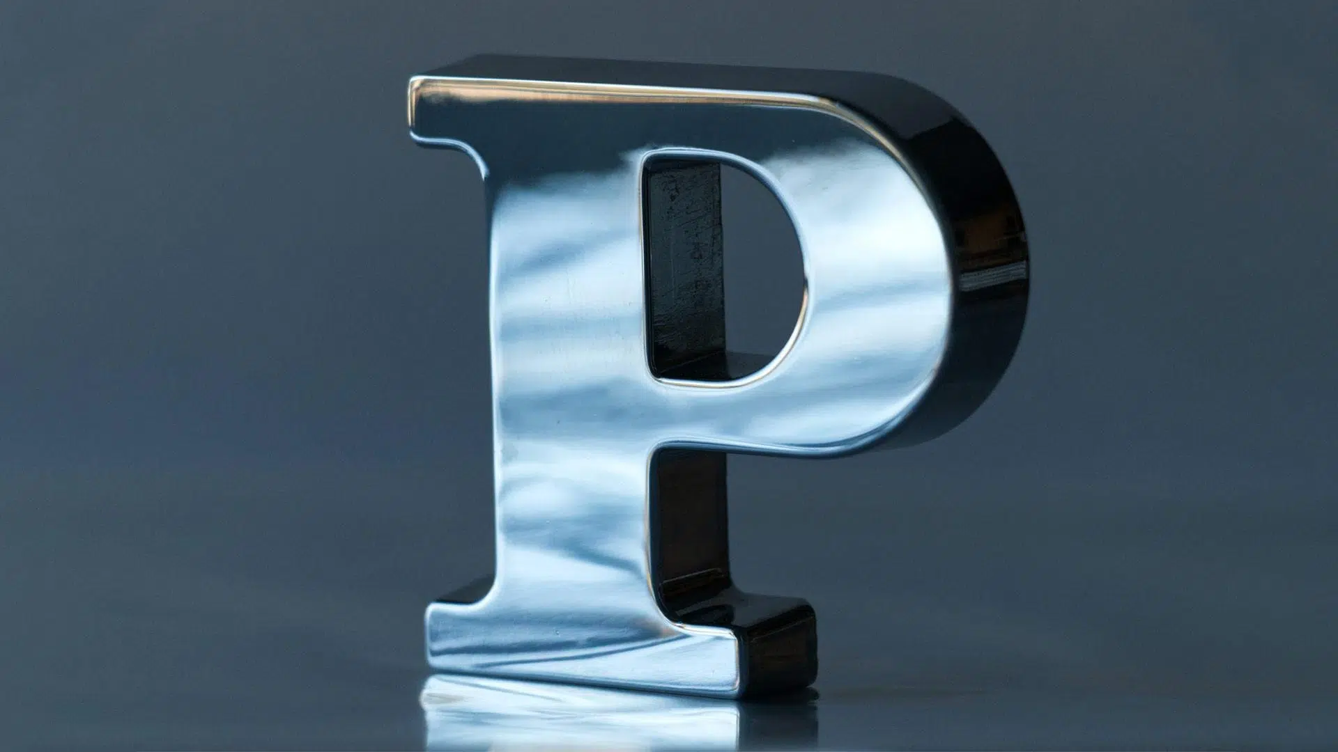 Metal Letter P on a Table