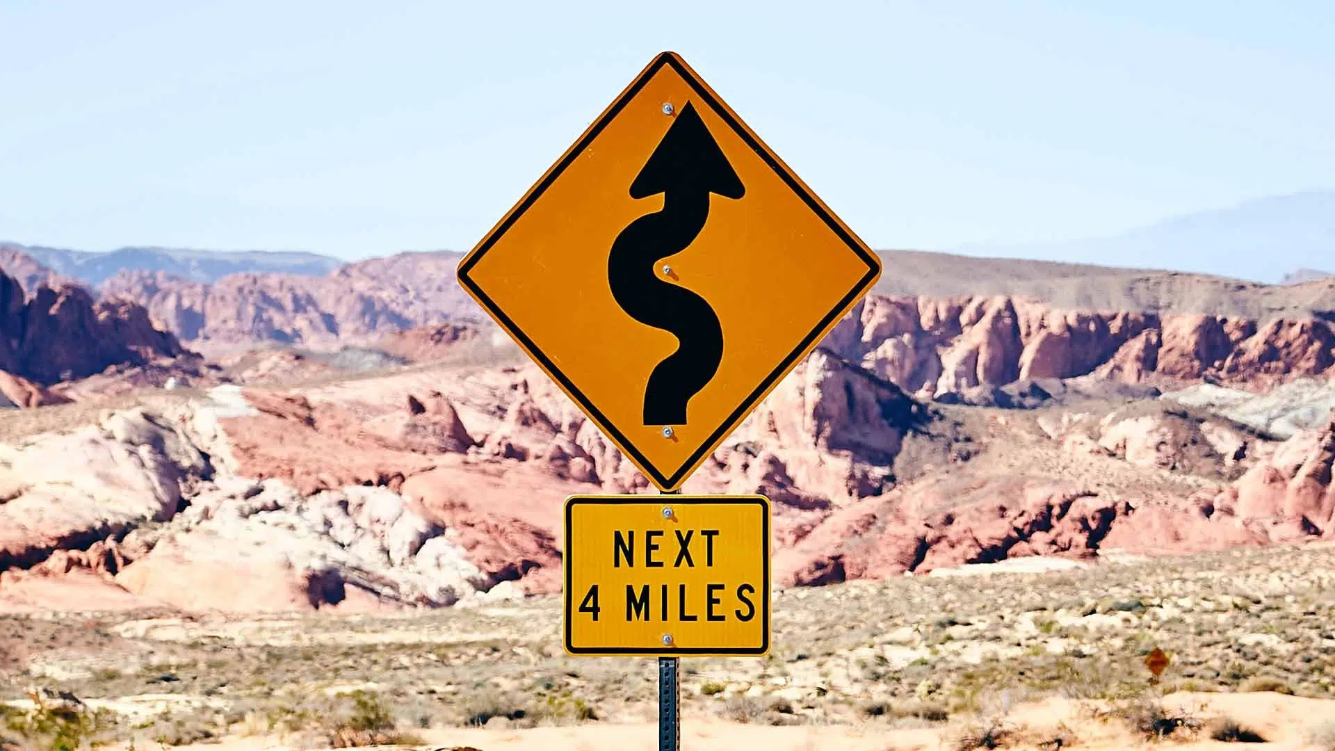 Winding Road Sign in the Desert