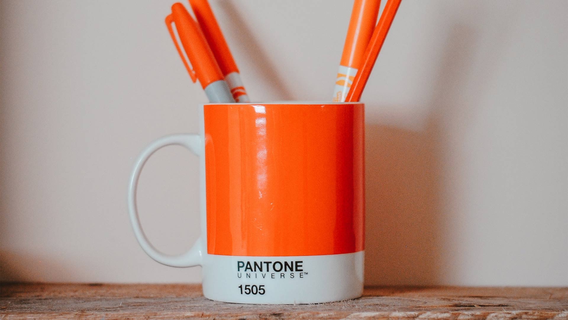 Orange Pantone Cup Holding Orange Writing Tools