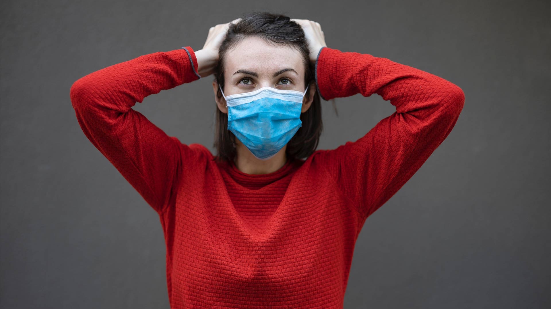 Woman Wearing Red with a Mask On