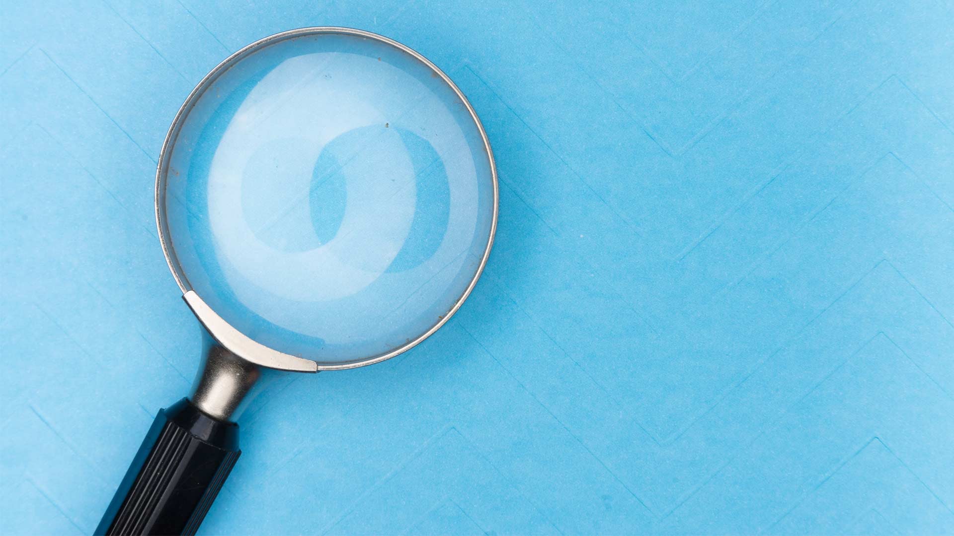 Magnifying Glass on Blue Background